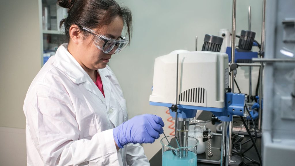 R&D Department techinican testing a material sample in the laboratory